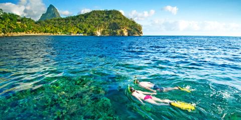 Couple snorkelling in Bluegreen waters of St Lucia